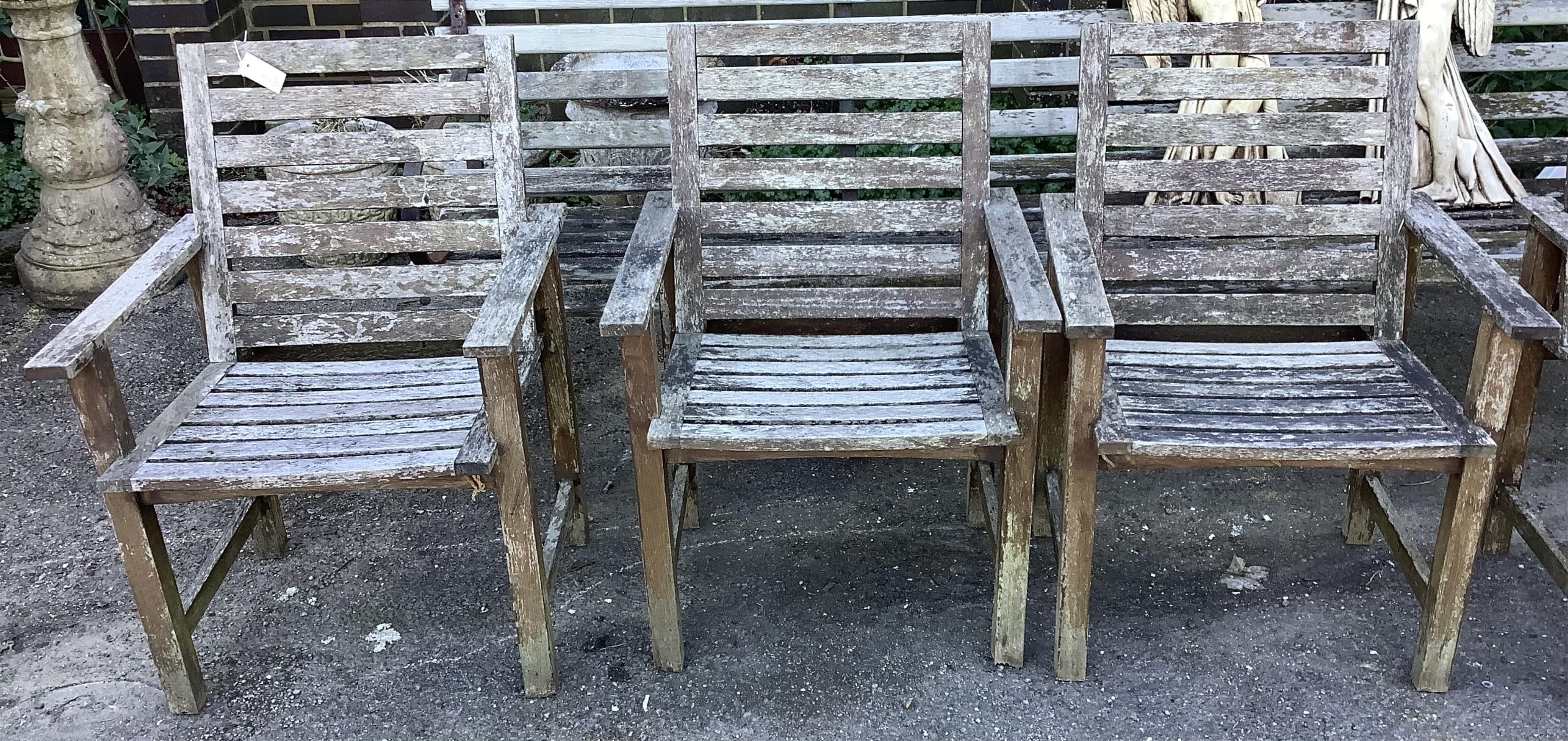 A rectangular weathered teak extending garden table, width 240cm extended, depth 100cm, height 74cm together with six weathered teak garden chairs. Condition - fair, table leaf has large chip